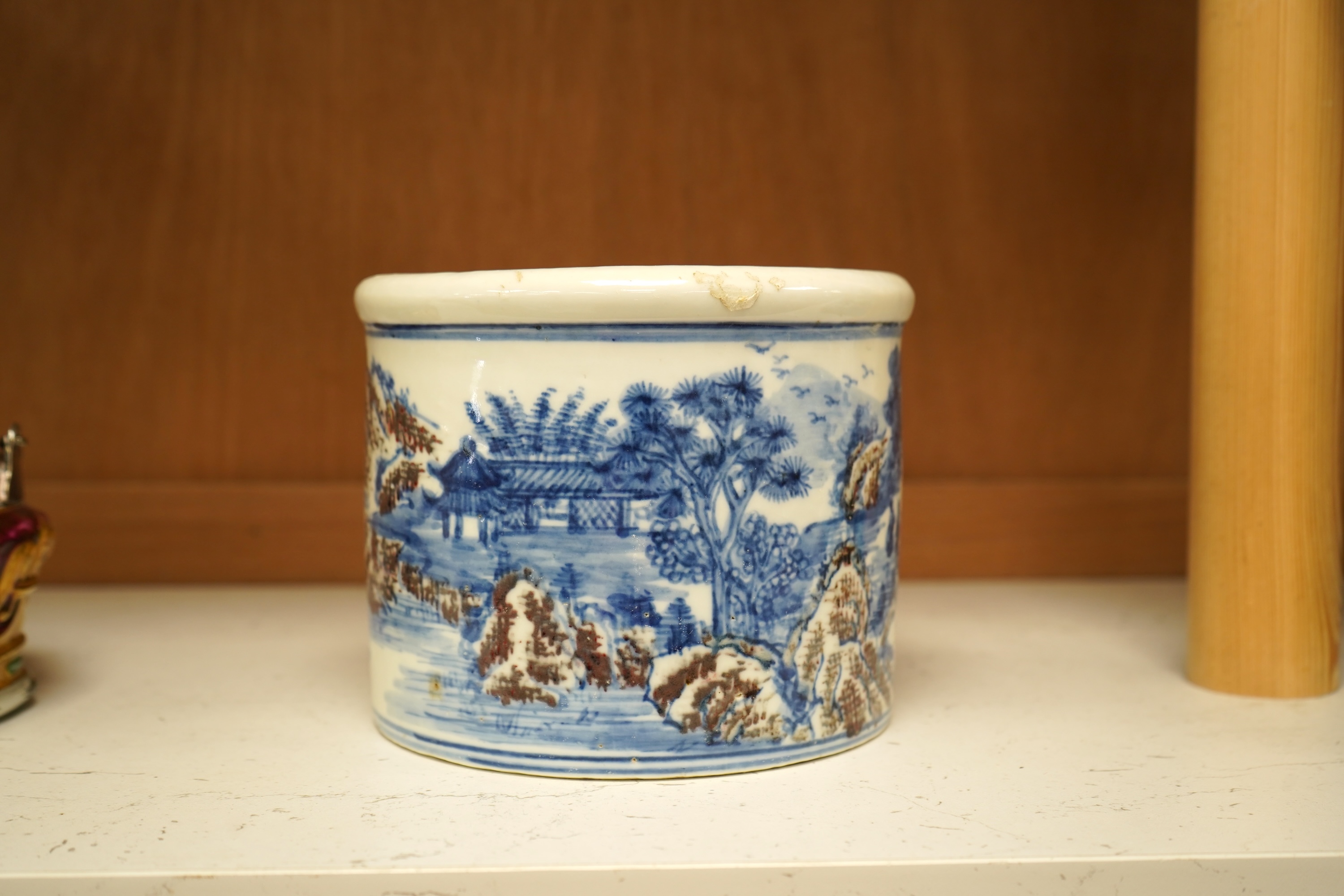 A Chinese blue and white with iron red cylindrical brush pot, 15cm in diameter